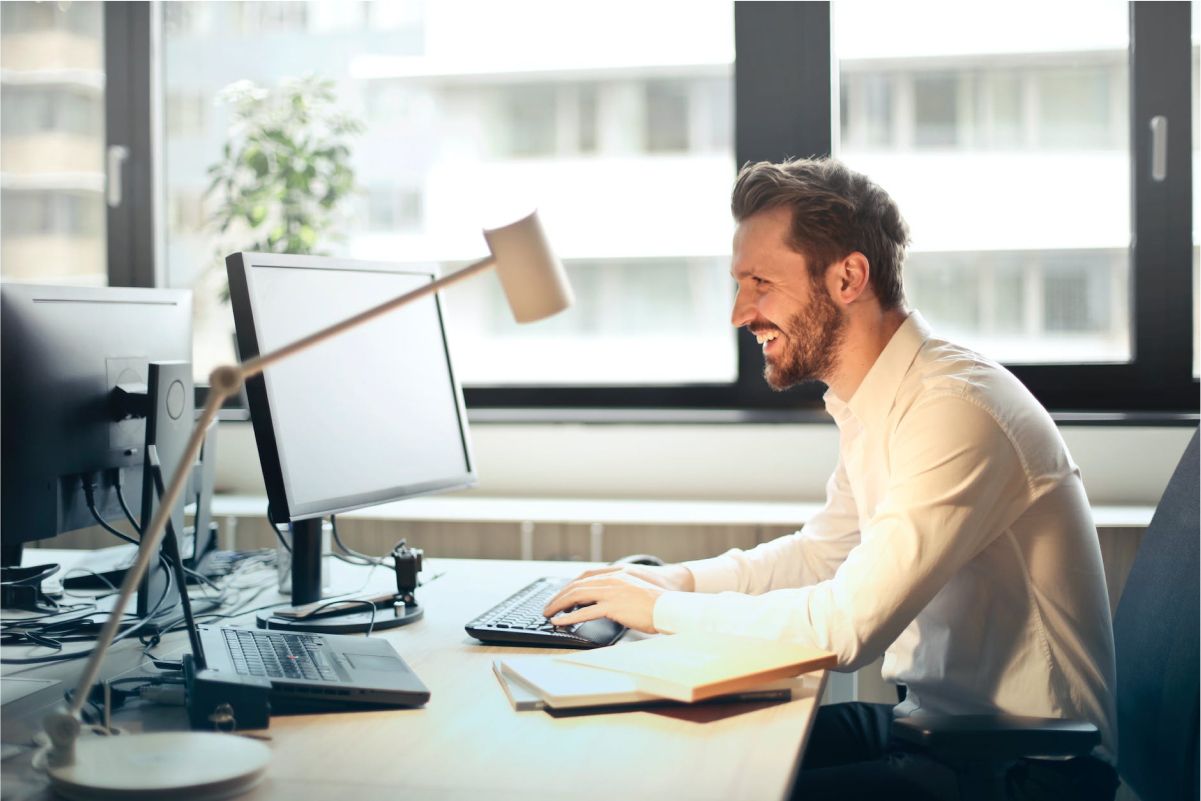 Man looking at his email at work