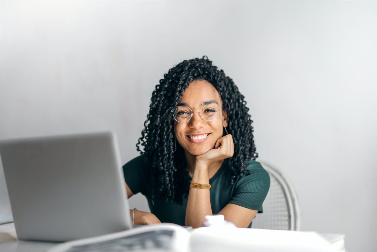 African American woman looking into the camera with a soft smile